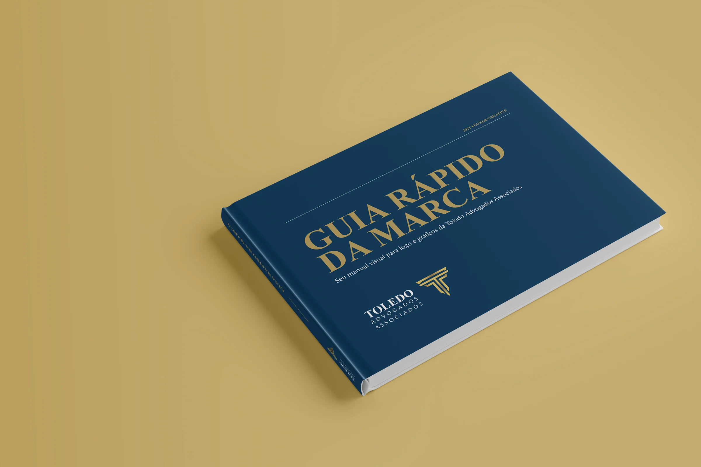 Guia rápido da marca Toledo impresso, capa azul com título dourado